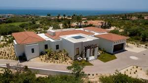 An outdoor terrace of a luxury condo for sale in a San Jose del Cabo golf community.